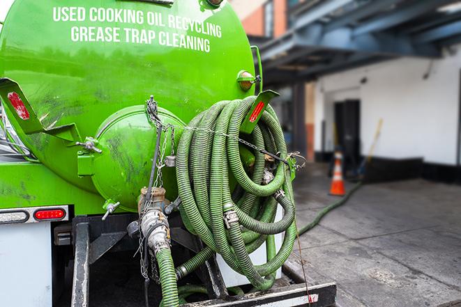 pumping out a heavy-duty grease trap at a restaurant in Broken Arrow